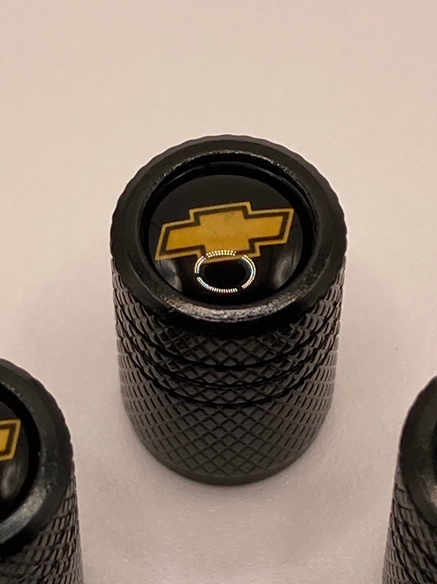 Chevrolet - 4pcs - black round valve stem cap set