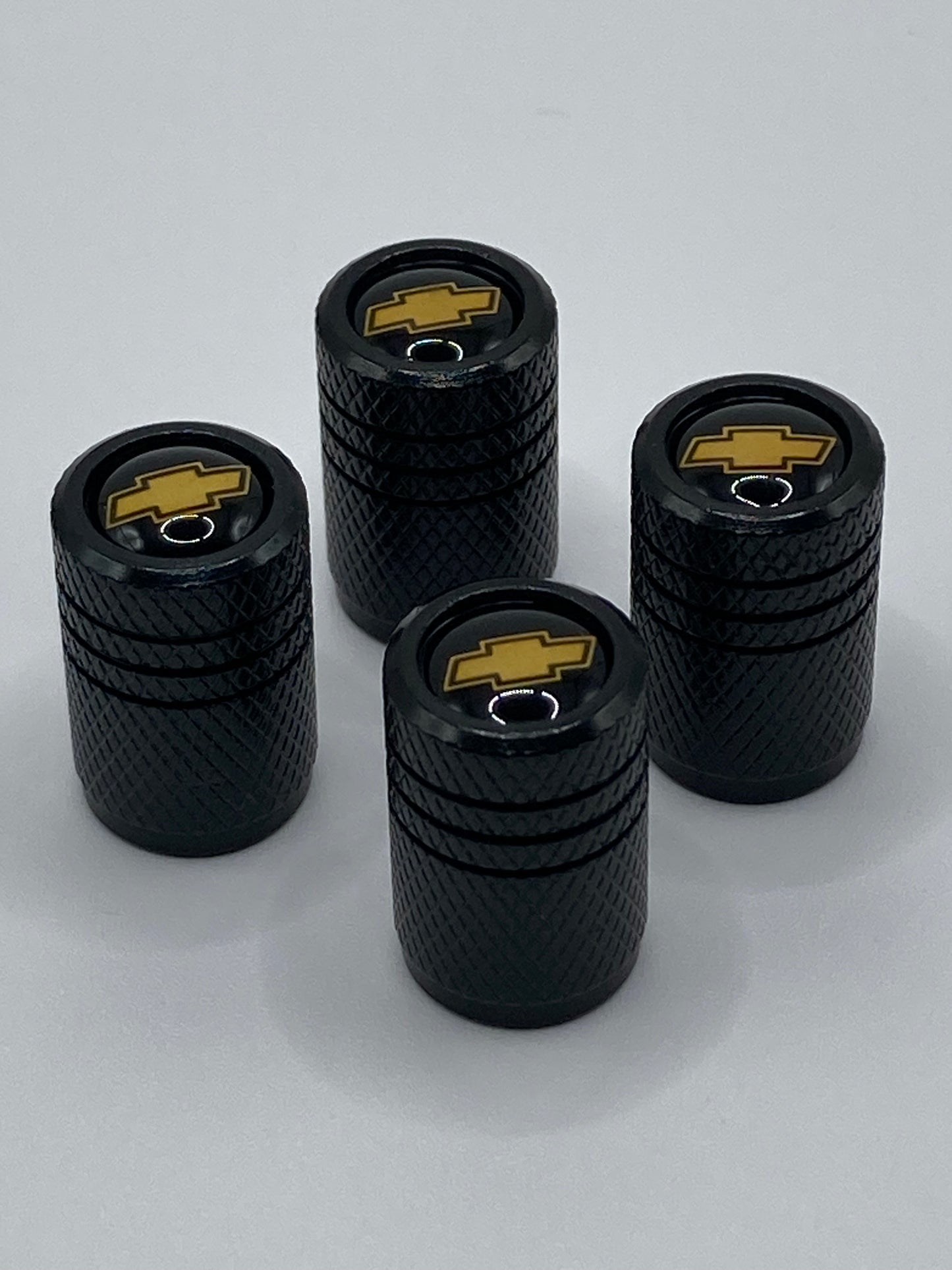 Chevrolet - 4pcs - black round valve stem cap set