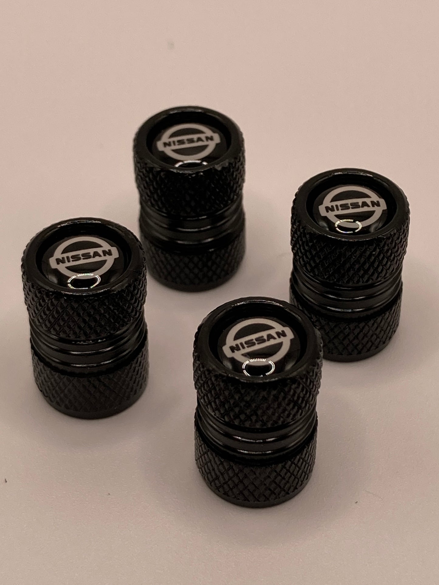 Nissan - black round valve stem cap set - 4pcs