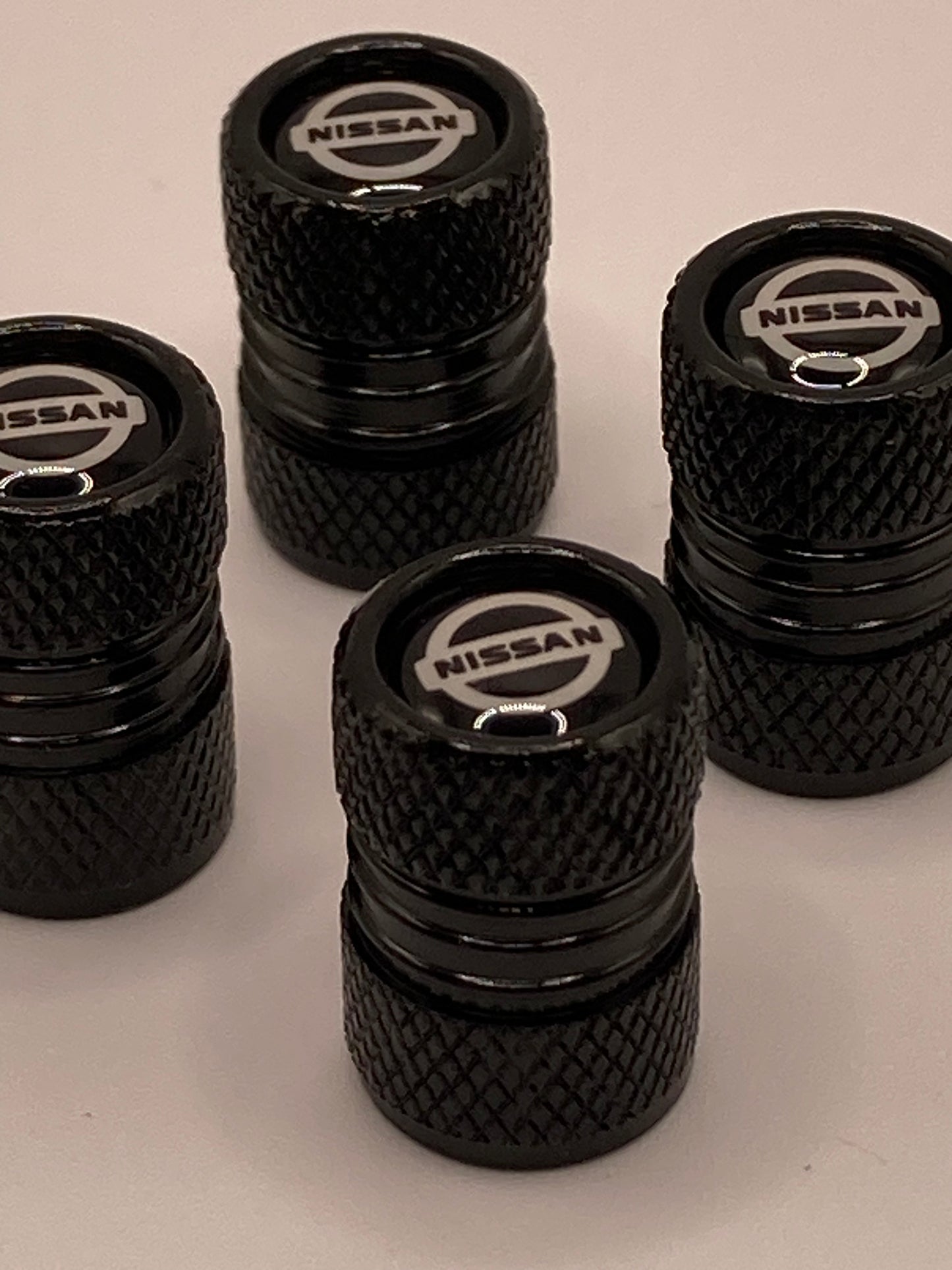 Nissan - black round valve stem cap set - 4pcs