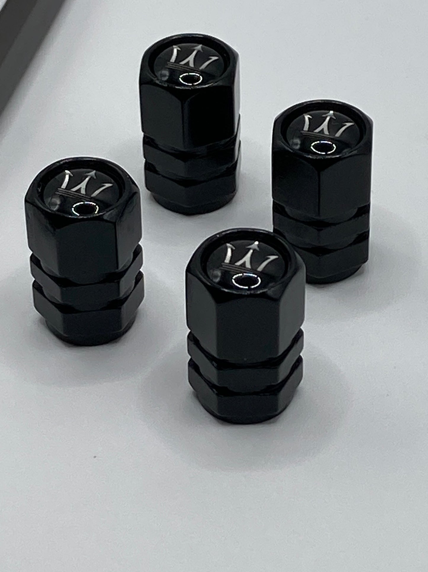Maserati 5pcs gift set - Clip-style Keychain and 4pcs valve stem caps