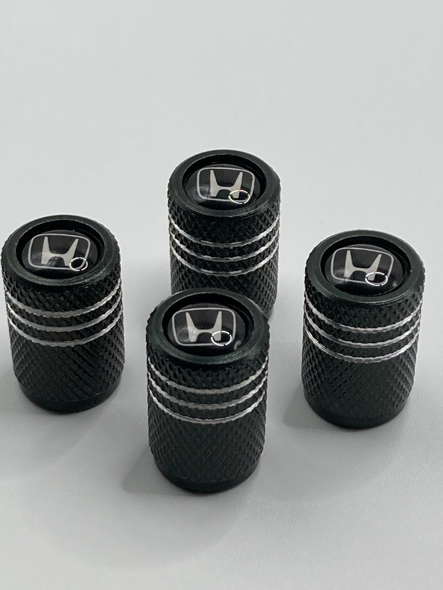 Honda - black/silver valve stem cap set - white logo - 4pcs