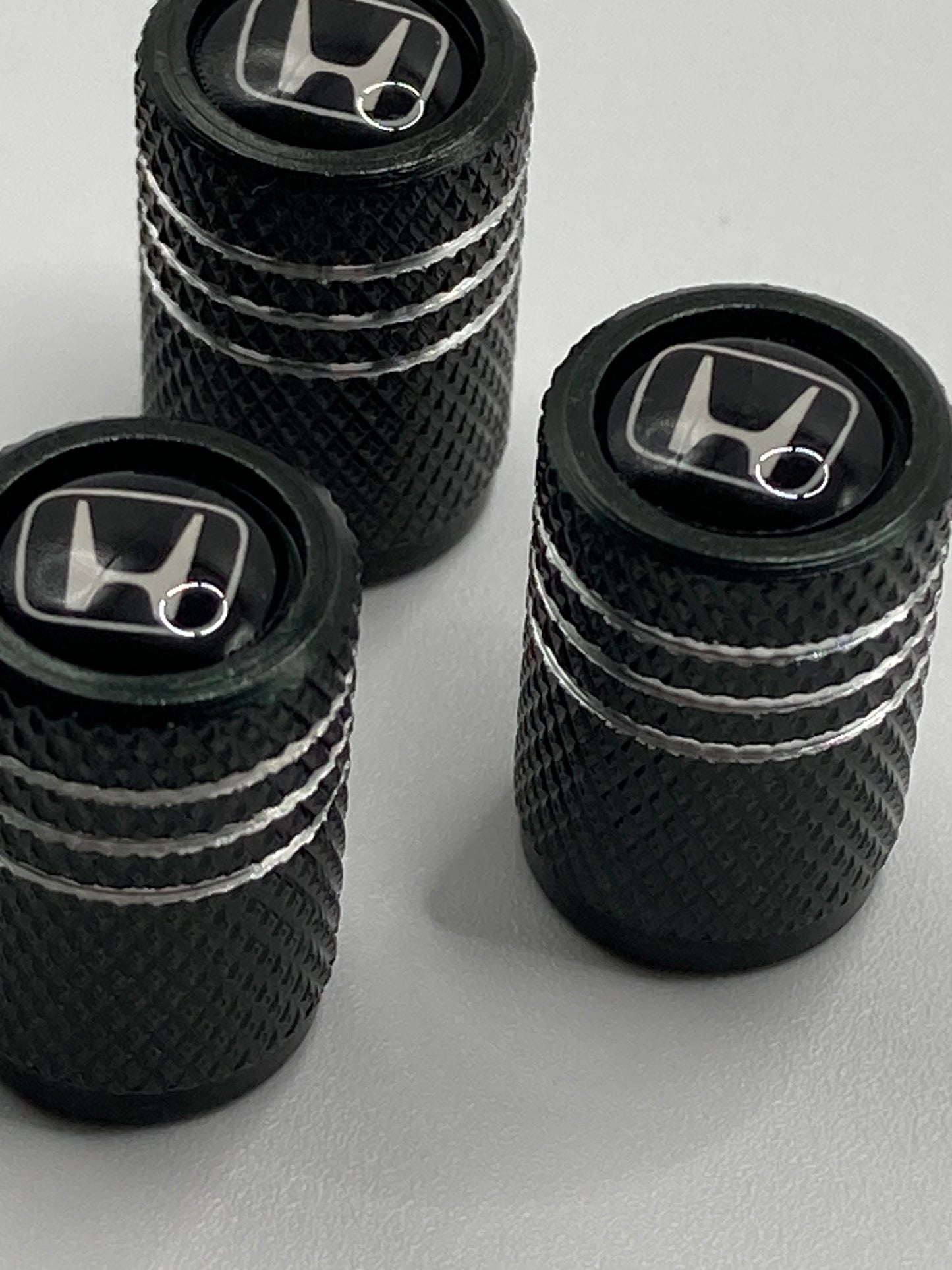 Honda - black/silver valve stem cap set - white logo - 4pcs