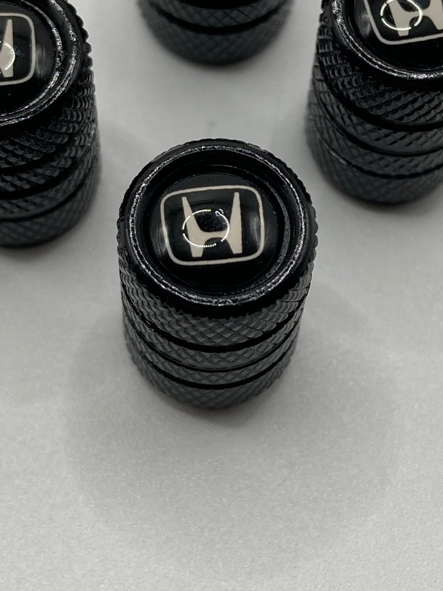 Honda - black valve stem cap set - white logo - 4pcs