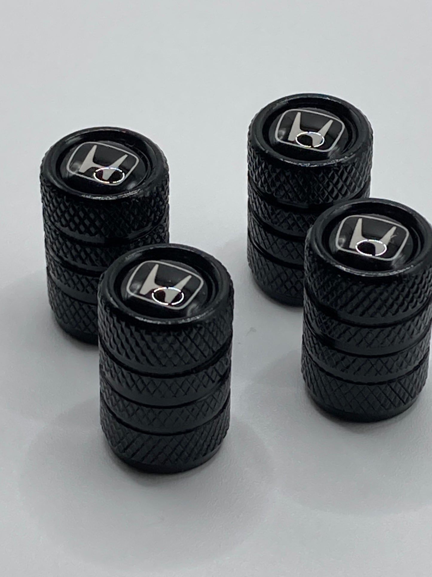 Honda - black valve stem cap set - white logo - 4pcs