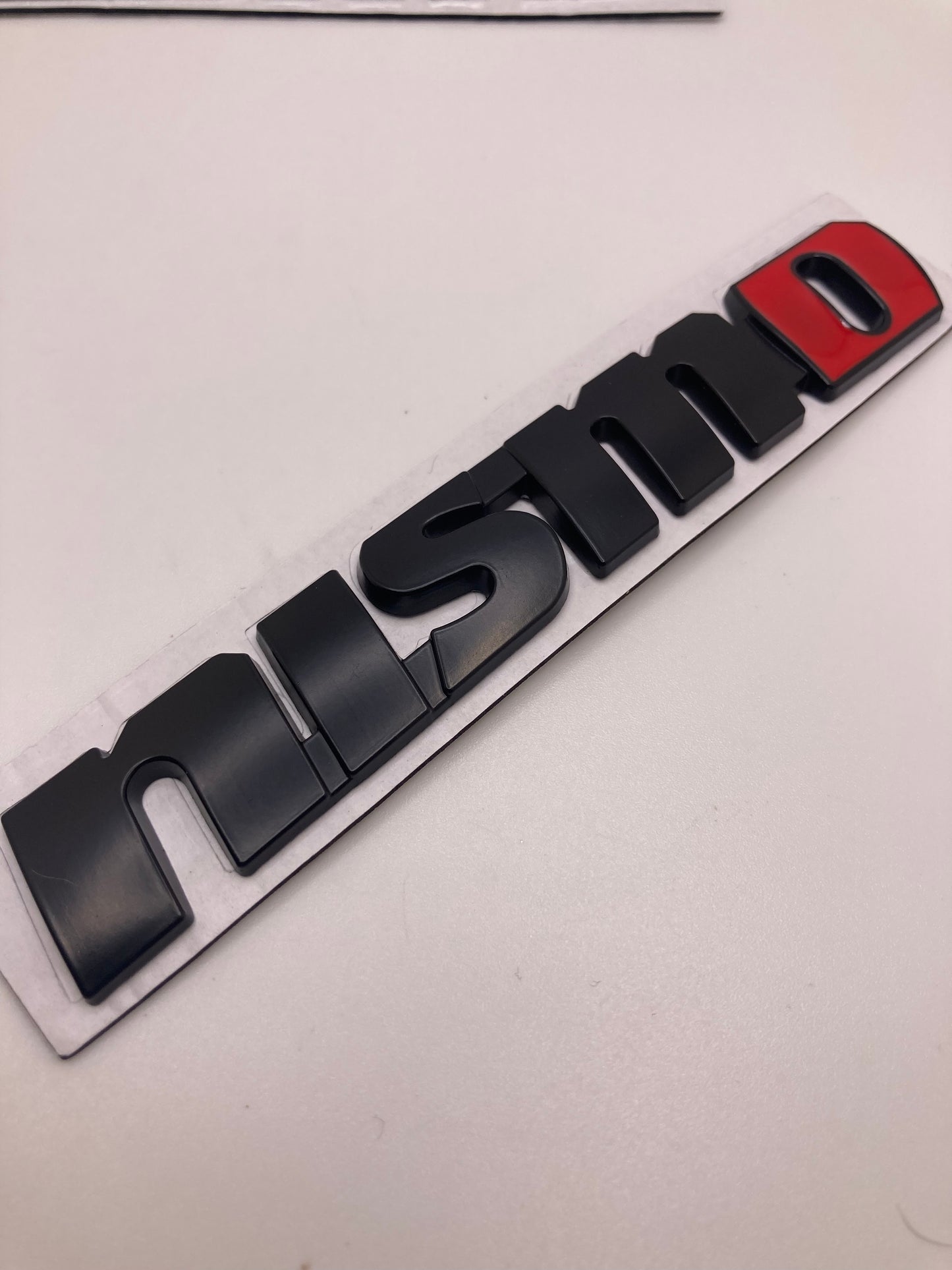 Nissan - Nismo metal badge trunk/fender emblem