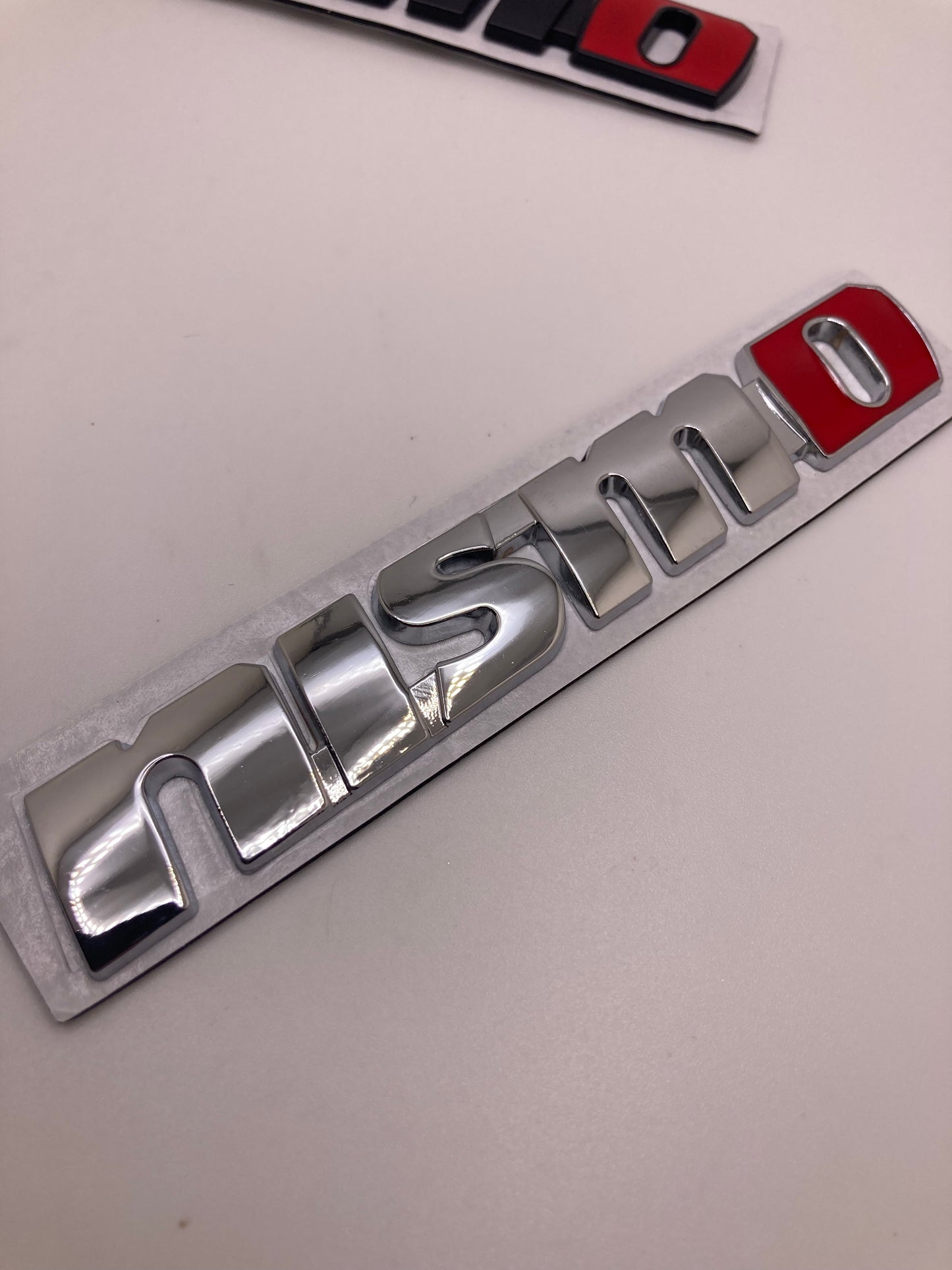 Nissan - Nismo metal badge trunk/fender emblem