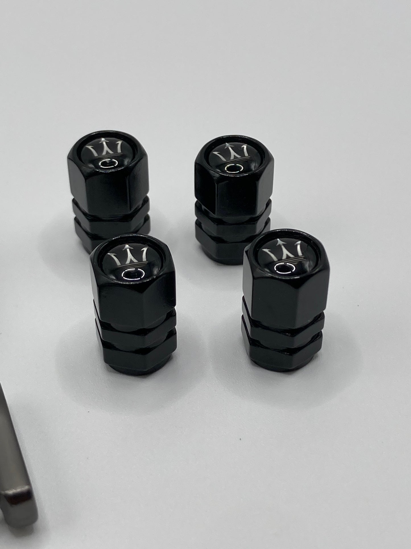 Maserati 5pcs gift set - Clip-style Keychain and 4pcs valve stem caps