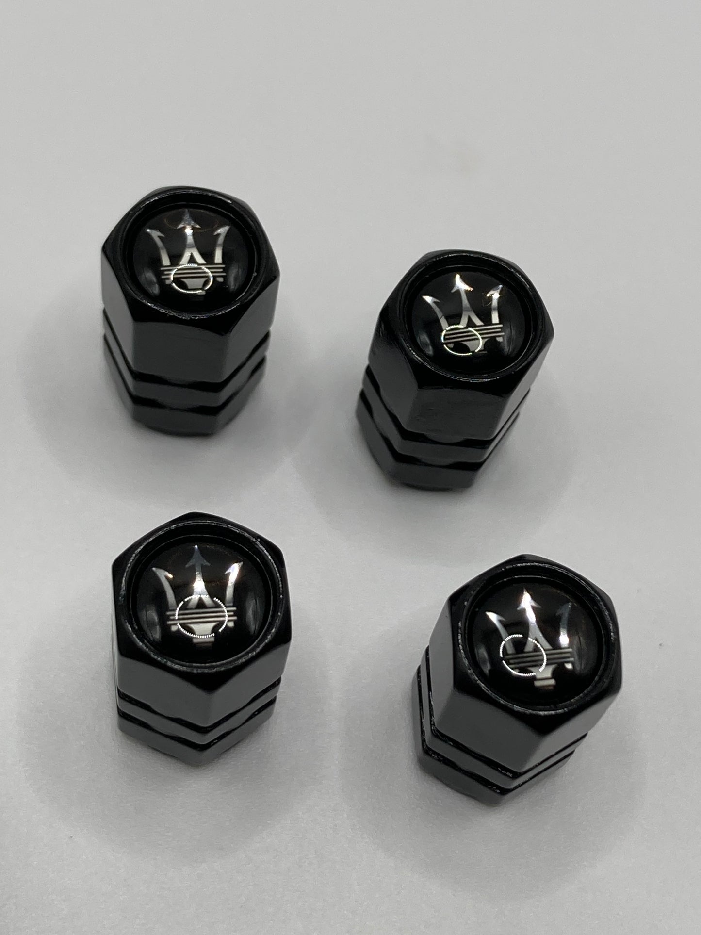 Maserati 5pcs gift set - Clip-style Keychain and 4pcs valve stem caps