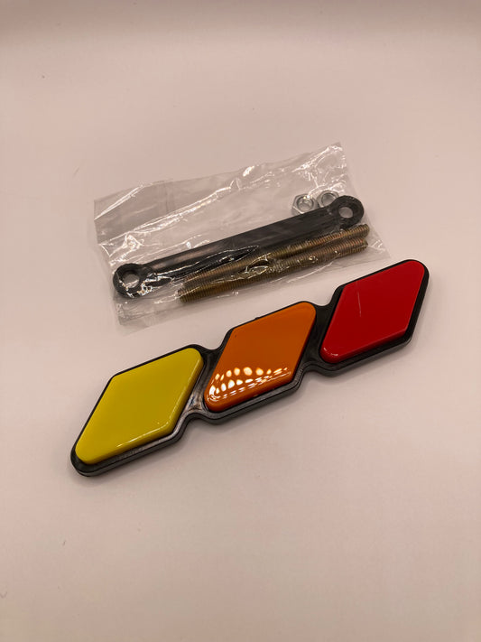 Tri-color grill badge and hardware - red, orange, yellow