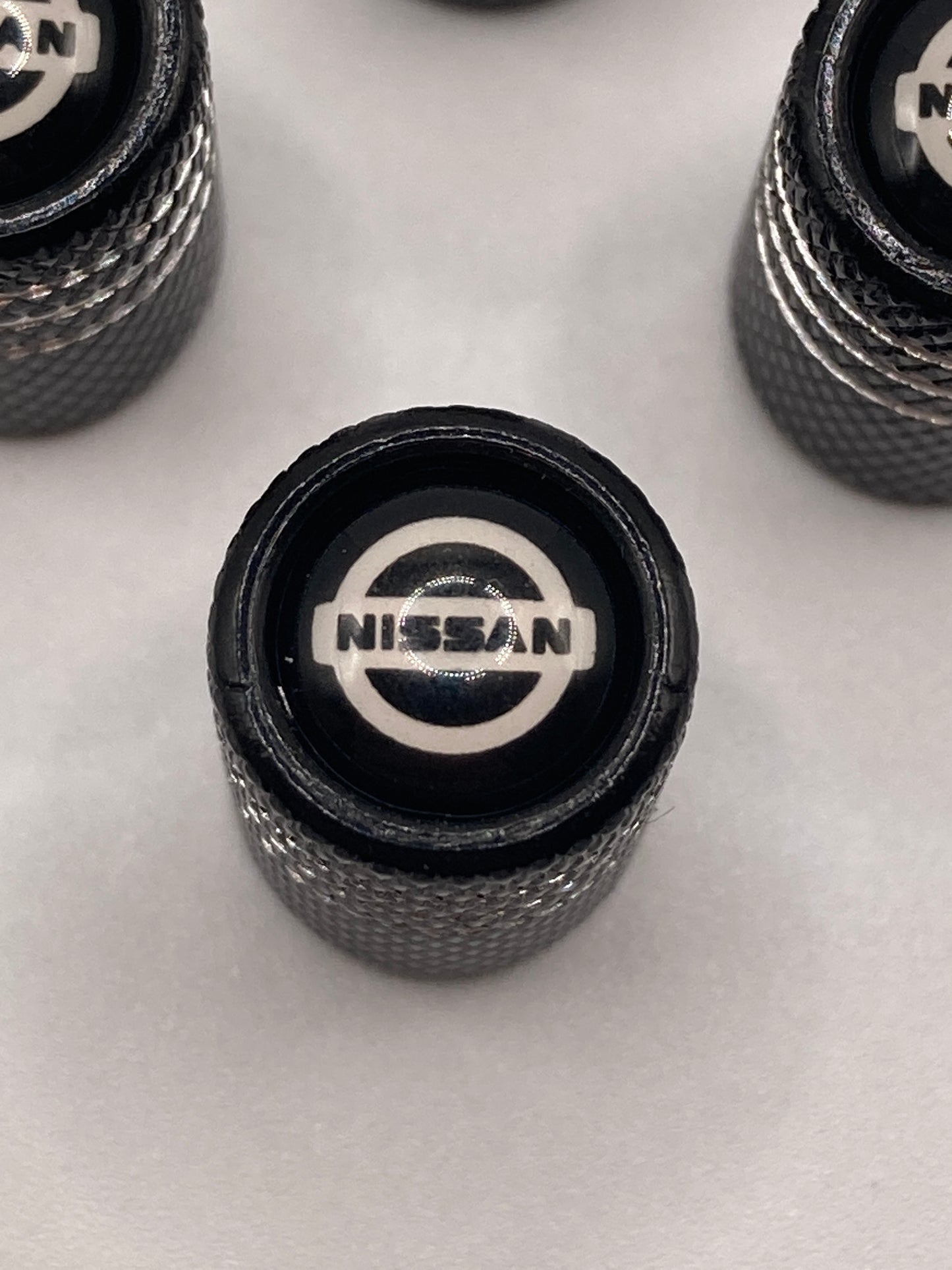 Nissan - blk/silver - Valve Stem Cap Set - 4pcs