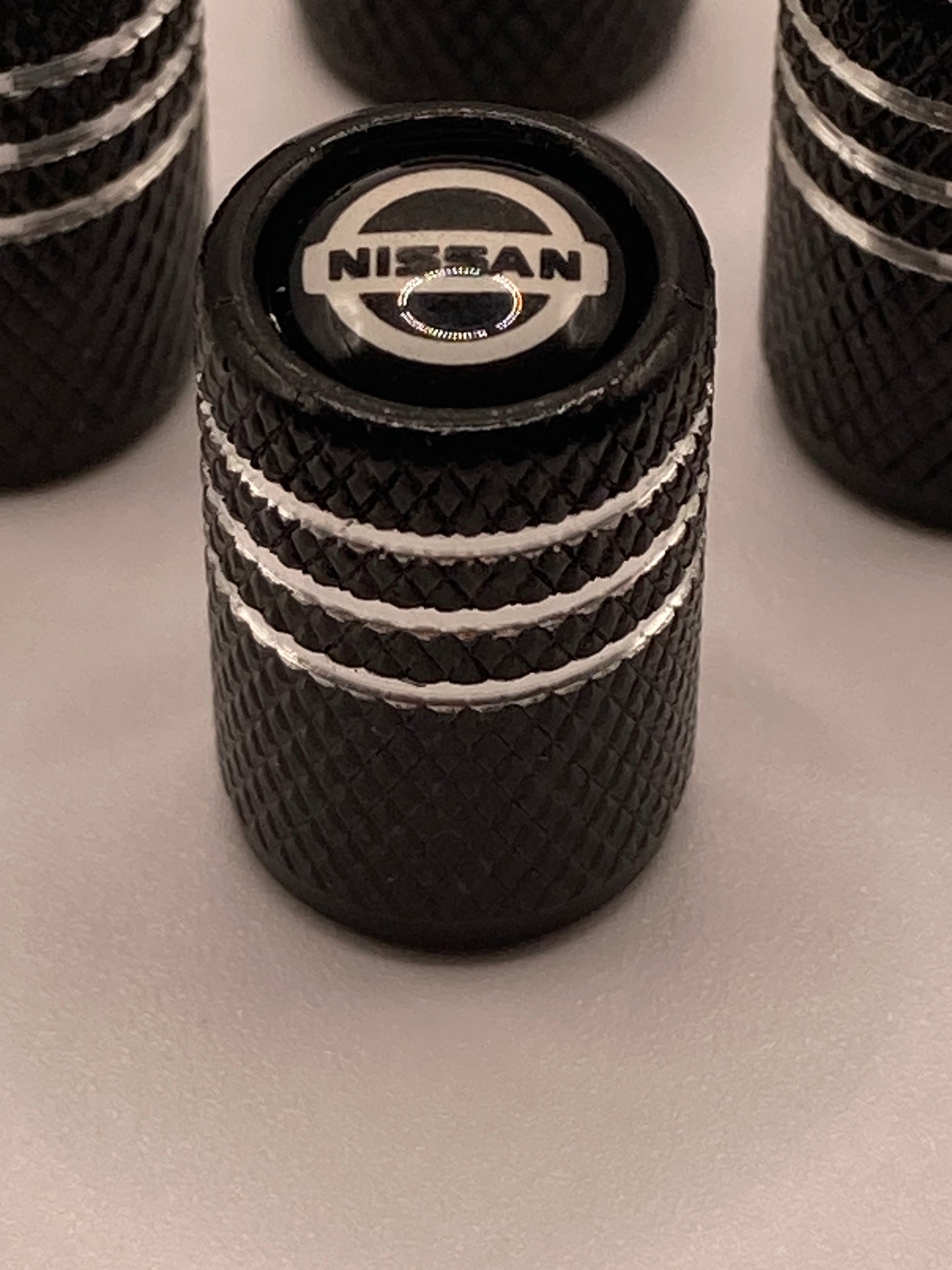 Nissan - blk/silver - Valve Stem Cap Set - 4pcs